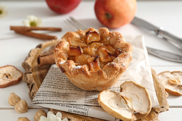 Tasty apple pie on white table
