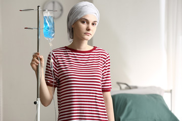 Young woman undergoing chemical therapy course in clinic