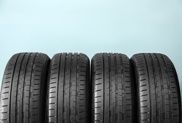 Obraz premium Car tires on color background