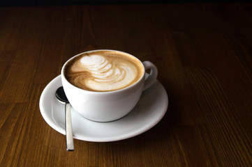 White creamy and spoon when finda brown table