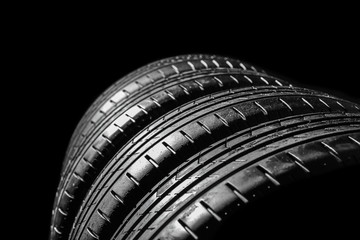 Car tires on dark background, closeup