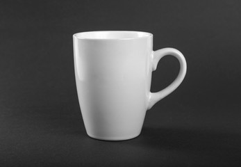 Empty white mug on a gray background.