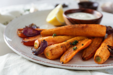 Tasty cooked carrot on plate, closeup