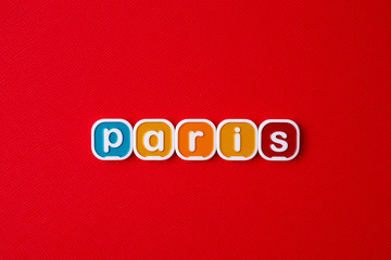 PARIS word block on RED background. 