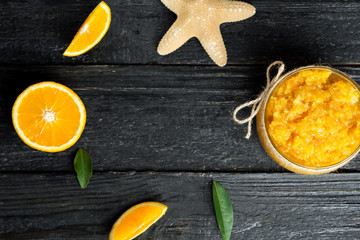 Homemade orange body scrub with copy space