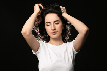 Portrait of beautiful woman on dark background