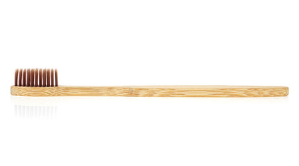 Toothbrush made of bamboo on white background