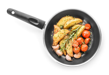 Frying pan with tasty baked potato on white background