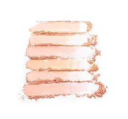 Samples of facial powder on white background