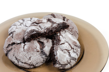 Round brownie cookies on dish close-up