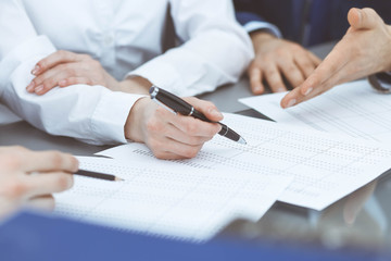Bookkeepers team or financial inspectors  making report, calculating or checking balance. Group of people at work. Business operations concept