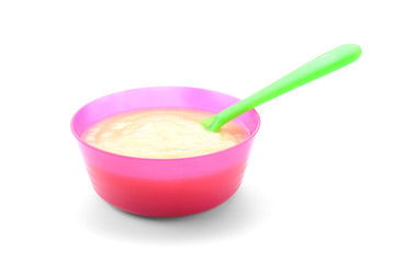 Bowl with healthy baby food on white background