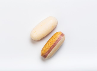 two yellow tablets  on a white background