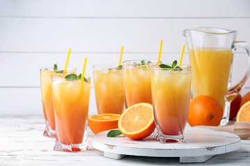 Glasses of tasty Tequila Sunrise cocktail on table