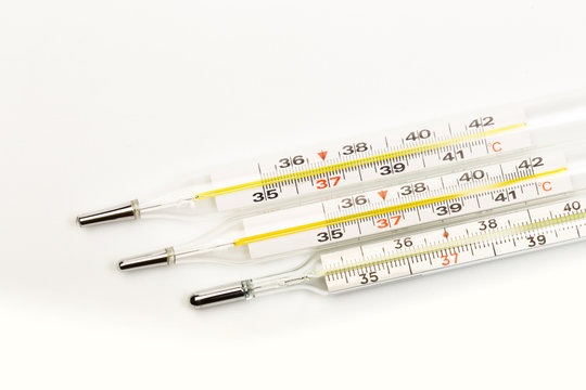 mercury thermometers on white background close up view