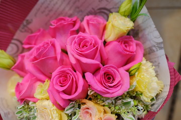 Macro view of colorful blue white yellow pink orange green purple rose flower bouquet in full blossom