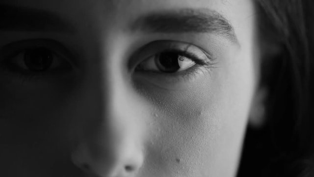 Closeup portrait of a beautiful girl. Black and white video.