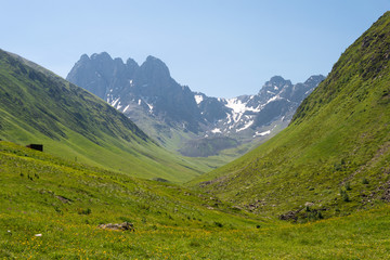 Fototapeta na wymiar Kazbegi, Georgia - Jul 03 2018: Juta valley near Caucasus mountain. a famous landscape in Kazbegi, Mtskheta-Mtianeti, Georgia.