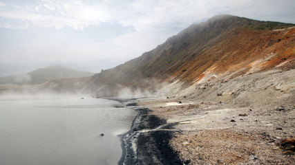 Fototapeta na wymiar Panorama of the boiling lake in caldera of Golovnina volcano, Kunashir island, Russia