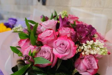 Macro view of colorful blue white yellow pink orange green purple rose flower bouquet in full blossom