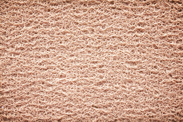 Top view light brown rubber doormat texture with curly seamless patterns for background