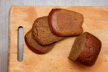 slices of brown baked bread on wooden cutting board