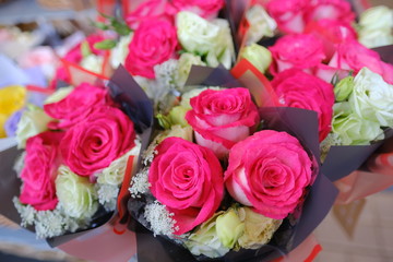 Macro view of colorful blue white yellow pink orange green purple rose flower bouquet in full blossom