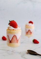 Homemade  strawberry cake on white dish.