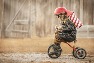 Boy play in the rider and the rocketman - obrazy, fototapety, plakaty