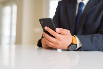 Close up of business man hands using smarpthone