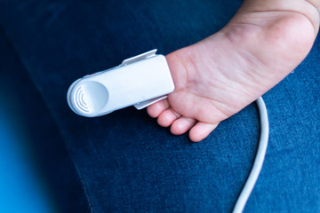 Fingertip Pulse Oximeter on toe of little baby child