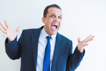 Middle age business man celebrating and screaming happy for succesful win