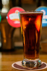 Close up shot of a glass of dark beer