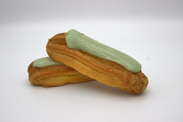 Two Delicious Pistachio Eclairs. An Isolated Image On White Background
