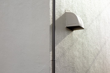 Wall and an exhaust port 