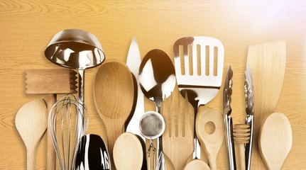 Kitchen metal and wooden utensil on  background