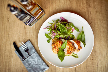 grilled chicken breast and salad