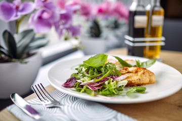 grilled chicken breast and salad
