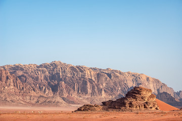 Fototapeta na wymiar amazing view in incredible lunar landscape in Wadi Rum village in the Jordanian red sand desert. Wadi Rum also known as The Valley of the Moon, Jordan - Image