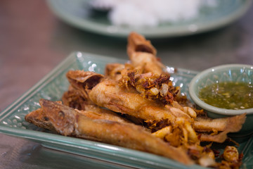 Dish of fried fishes served with seafood dip