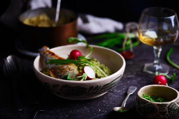 risotto with wild garlic and sea bass.style rustic.