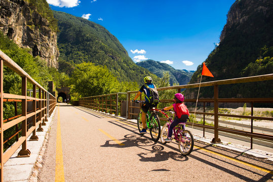 Father and daughter going in bicycle