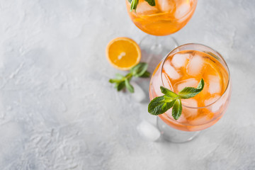 Classic Italian aperol spritz cocktail on light. Close up.