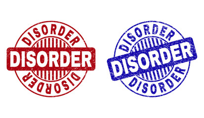 Grunge DISORDER round stamp seals isolated on a white background. Round seals with grunge texture in red and blue colors. Vector rubber overlay of DISORDER caption inside circle form with stripes.