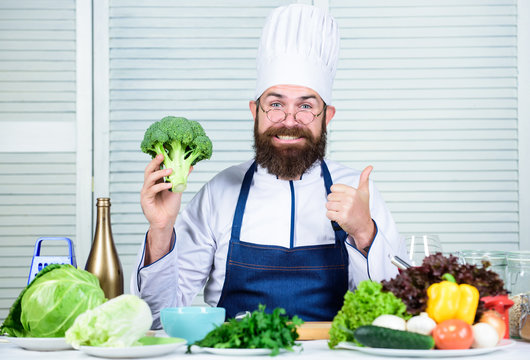 Healthy nutrition concept. Bearded professional chef cooking healthy food. Healthy vegetarian recipe. Organic vegetables. I choose only healthy ingredients. Man cook hat and apron hold broccoli