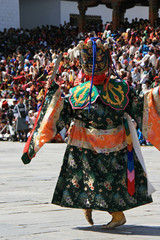 Fototapeta na wymiar Traditional dances during a religious festival (tsechu) in a dzong in Thimphu (Bhutan)