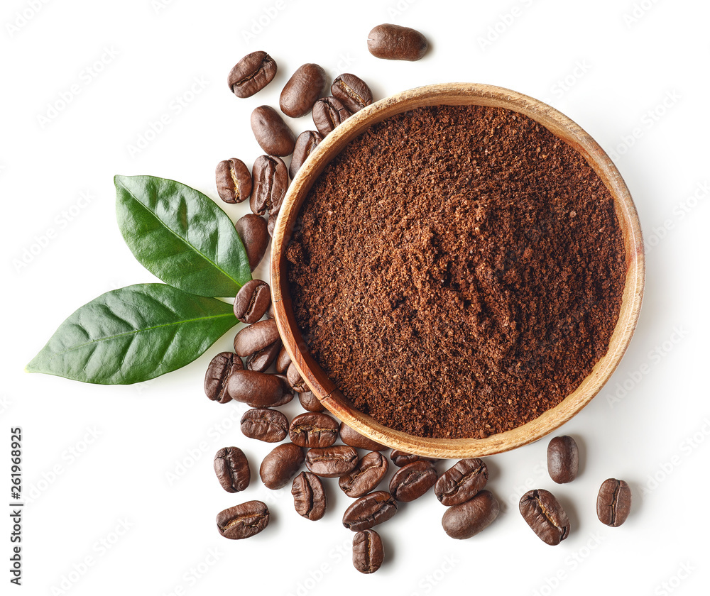 Wall mural Bowl of ground coffee and beans isolated on white background