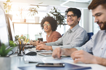 Young male team working at IT developing company