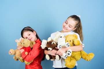 Charity sale. Love and friendship. Kids adorable cute girls play soft toys. Happy childhood. Child care. Sisters best friends play. Sweet childhood. Childhood concept. Softness and tenderness