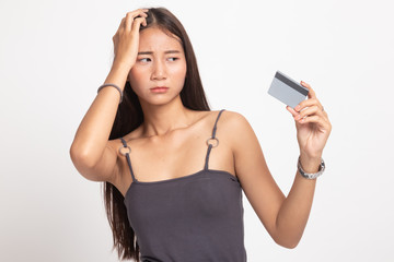Naklejka premium Young Asian woman headache with a blank card.